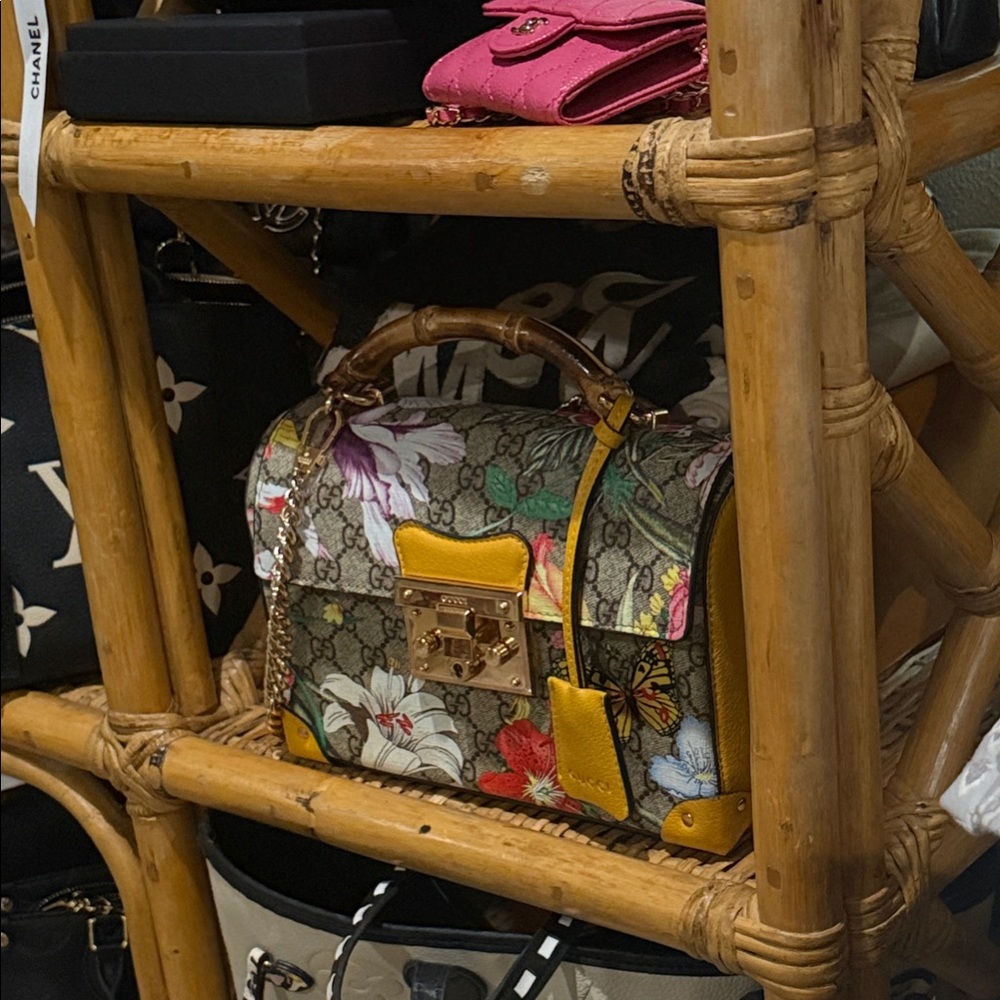 Gucci  Designer Handbag with Gold Accents